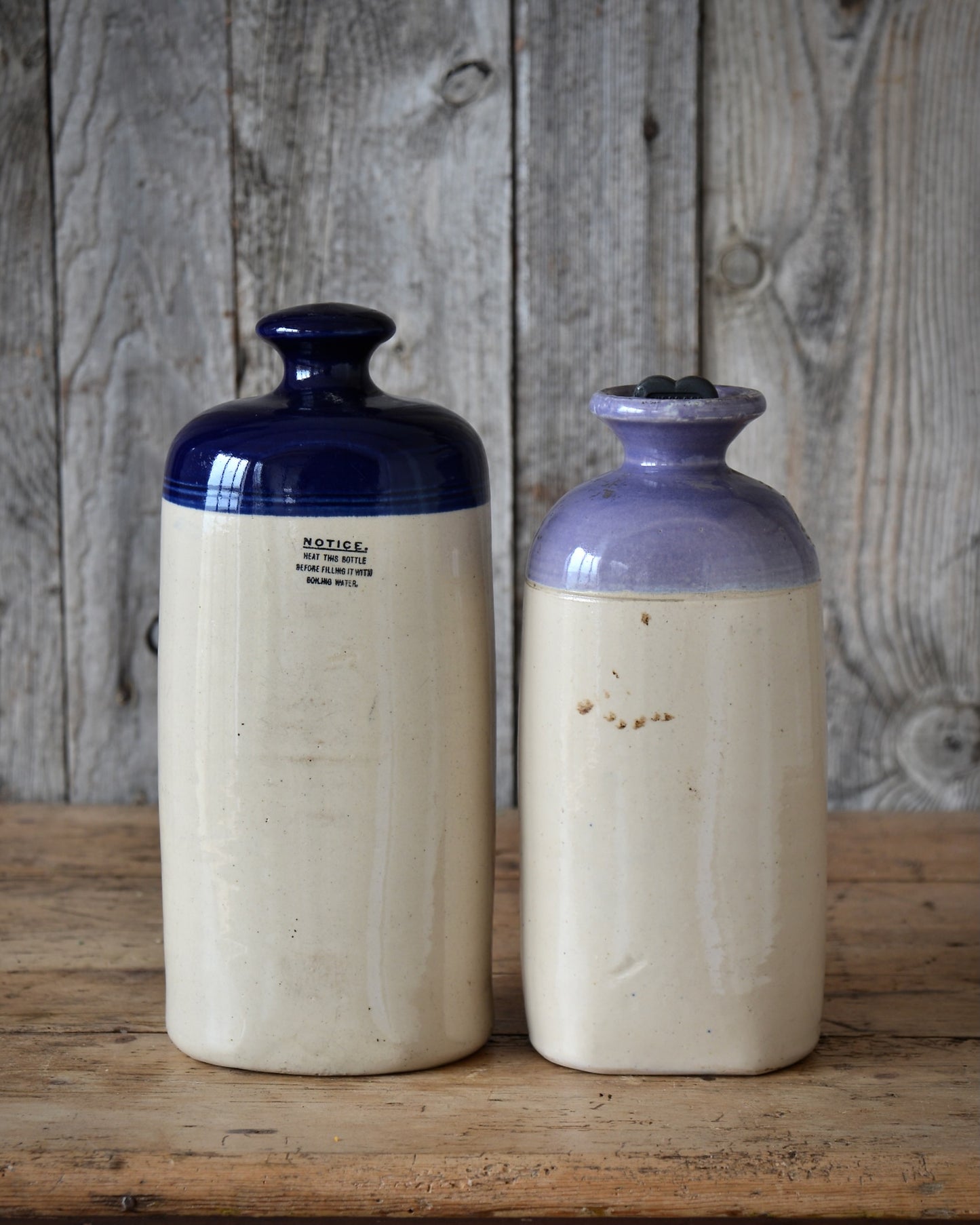 Two stoneware footwarmers.