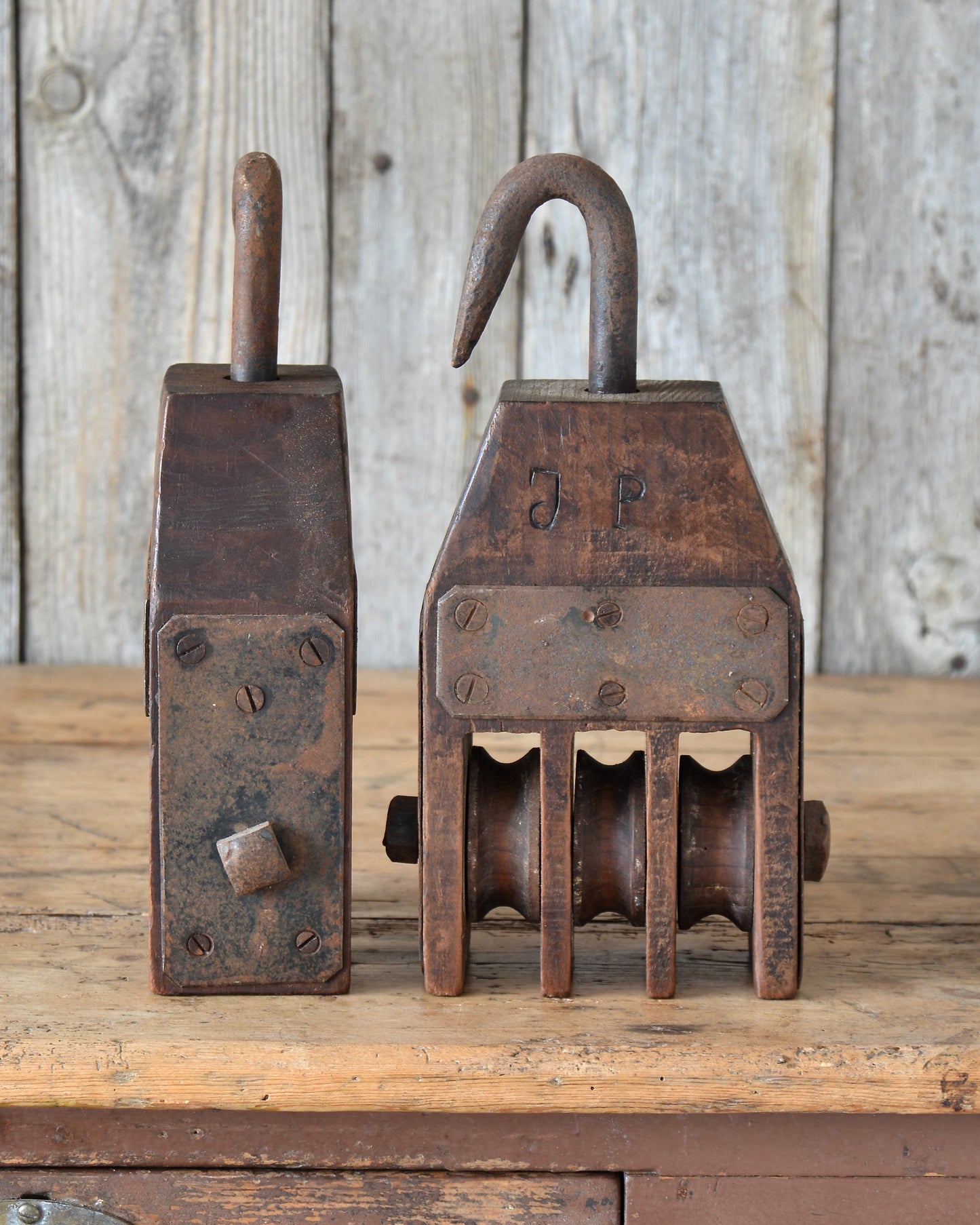 A pair of maritime pulleys.